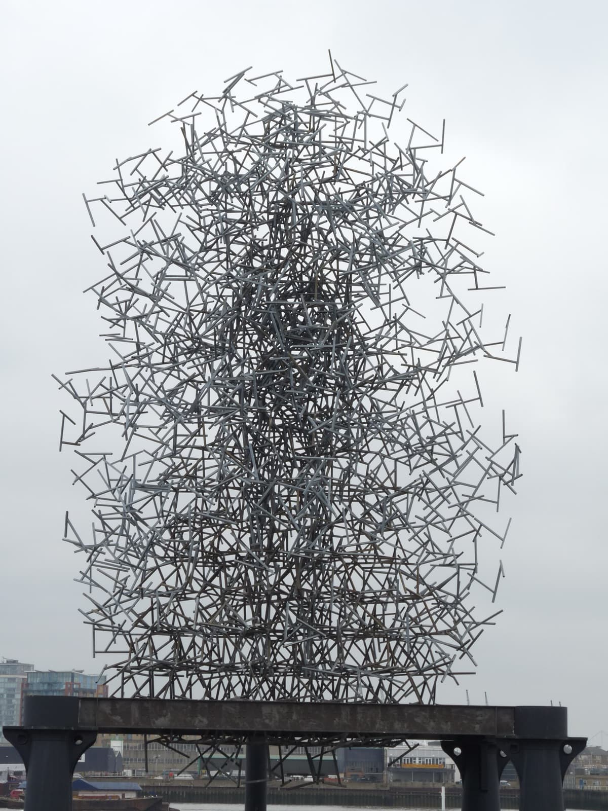 Close view of Quantum Cloud showing the dense human figure at the centre of the steel cloud
