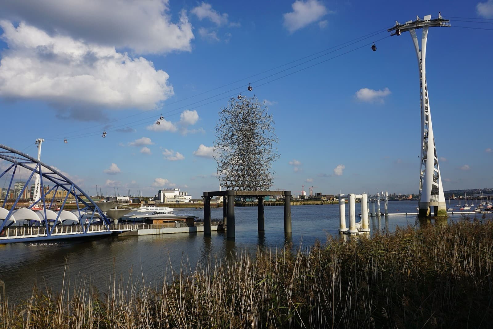 Quantum Cloud next to North Greenwich Pier with the river and the far bank behind it